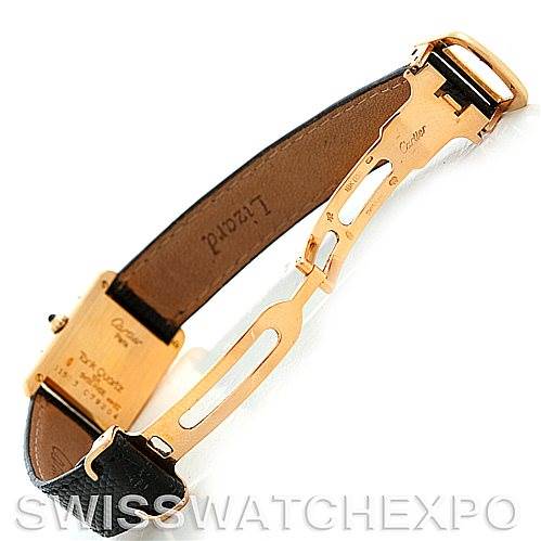 The image shows the underside of a Cartier Tank Classic Women's Yellow Gold Silver Dial Women's Yellow Gold Silver Dial watch, highlighting the strap and clasp mechanism.