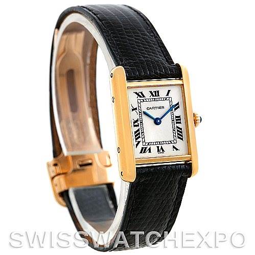 This image shows a Cartier Tank Classic Women's Yellow Gold Silver Dial Women's Yellow Gold Silver Dial watch at a slight angle, highlighting the rectangular dial, black leather strap, and gold casing.