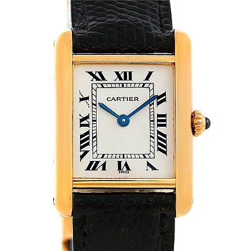 The image shows the front view of the Cartier Tank Classic Women's Yellow Gold Silver Dial Women's Yellow Gold Silver Dial watch, highlighting its rectangular case, Roman numerals, blue hands, and leather strap.
