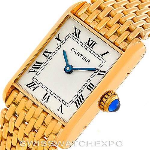 This image shows a close-up, angled view of the Cartier Tank Classic Women's Yellow Gold Silver Dial Women's Yellow Gold Silver Dial watch, highlighting the face, bezel, crown, and part of the bracelet.