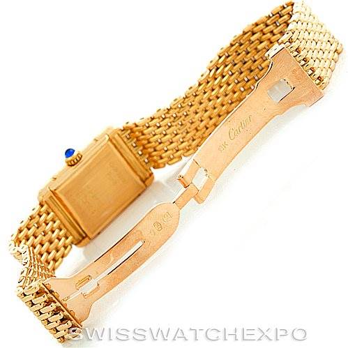 The image displays the clasp and back of a Cartier Tank Classic Women's Yellow Gold Silver Dial Women's Yellow Gold Silver Dial watch at an angle showing the gold mesh bracelet.