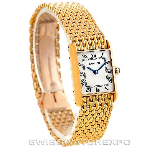 The image shows an angled view of a Cartier Tank Classic Women's Yellow Gold Silver Dial Women's Yellow Gold Silver Dial watch, highlighting its gold bracelet and rectangular dial with Roman numerals.