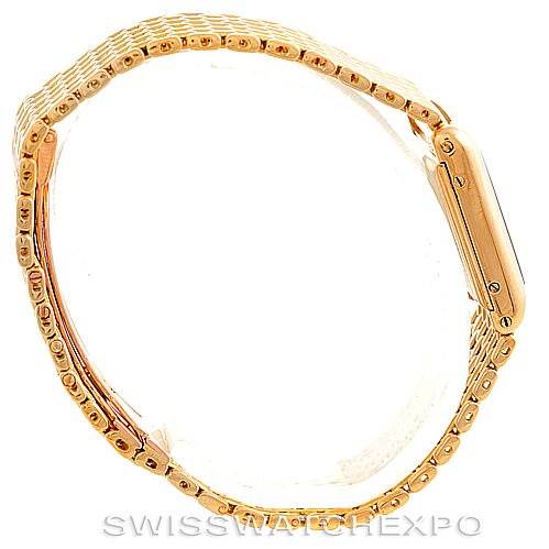 The image shows a side view of a Cartier Tank Classic Women's Yellow Gold Silver Dial Women's Yellow Gold Silver Dial watch, highlighting the bracelet and case.
