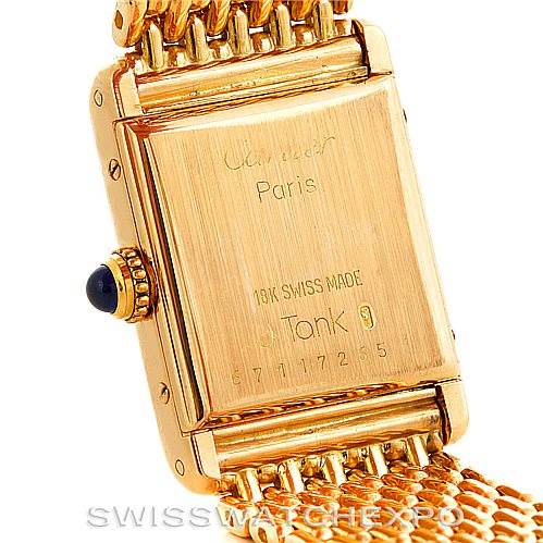 The image shows the back case and part of the bracelet of the Cartier Tank Classic Women's Yellow Gold Silver Dial Women's Yellow Gold Silver Dial watch.