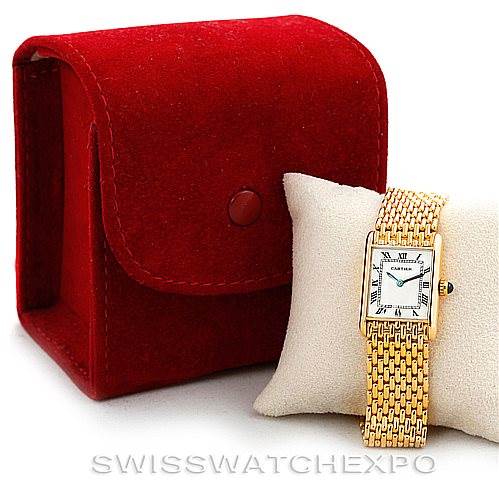 The image shows a Cartier Tank Classic Women's Yellow Gold Silver Dial Women's Yellow Gold Silver Dial watch with a gold bracelet, displayed on a cushion, alongside a red case.