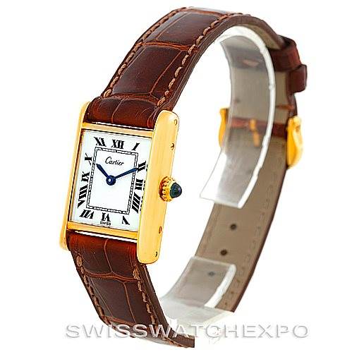 The image shows a Cartier Tank Classic Women's Yellow Gold White Dial Women's Yellow Gold White Dial watch at a three-quarter angle, highlighting its gold case, leather strap, and Roman numeral dial.