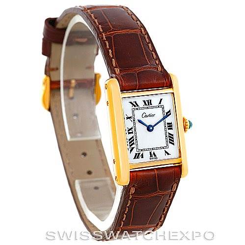 The image shows a Cartier Tank Classic Women's Yellow Gold White Dial Women's Yellow Gold White Dial model watch at a slight angle, showcasing the face, gold case, and brown leather strap.