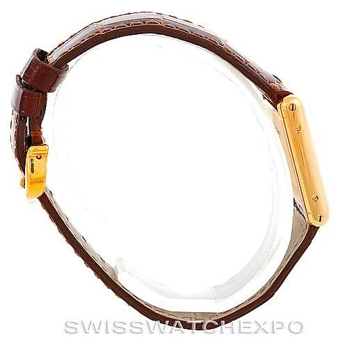 Side view of the Cartier Tank Classic Women's Yellow Gold White Dial Women's Yellow Gold White Dial watch, showing the strap and the case.