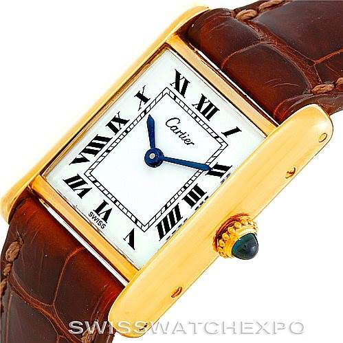 This is a close-up angle of a Cartier Tank Classic Women's Yellow Gold White Dial Women's Yellow Gold White Dial watch, showing the face, bezel, crown, and part of the leather strap.
