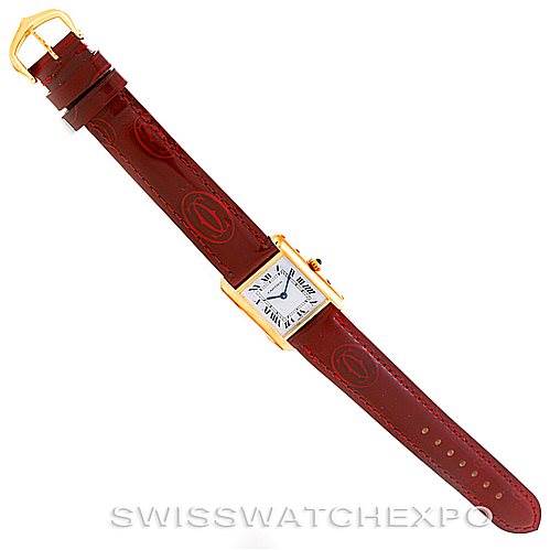 The image shows the entire Cartier Tank Classic Women's Yellow Gold White Dial Women's Yellow Gold White Dial watch from a top-down angle, including the face, case, and full leather strap.
