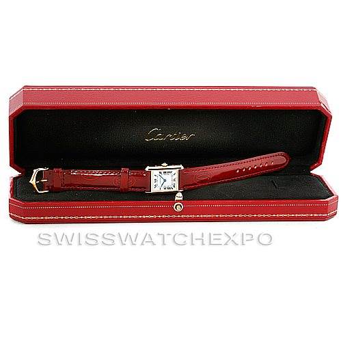 The Cartier Tank Classic Women's Yellow Gold White Dial Women's Yellow Gold White Dial watch is shown from a top-down angle, displayed in a red watch box.