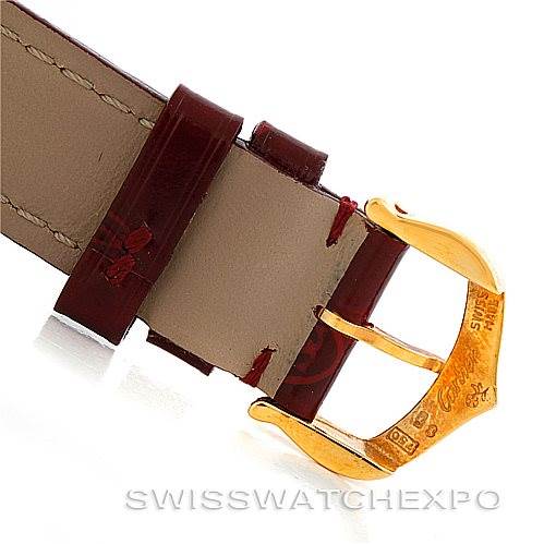 The image shows a close-up of the strap and buckle of a Tank Classic model watch by Cartier.