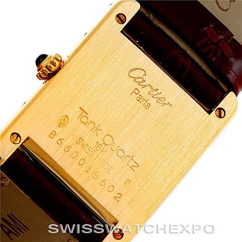 This image shows the backplate of the Cartier Tank Classic Women's Yellow Gold White Dial Women's Yellow Gold White Dial watch, including the brand engravings and model details.