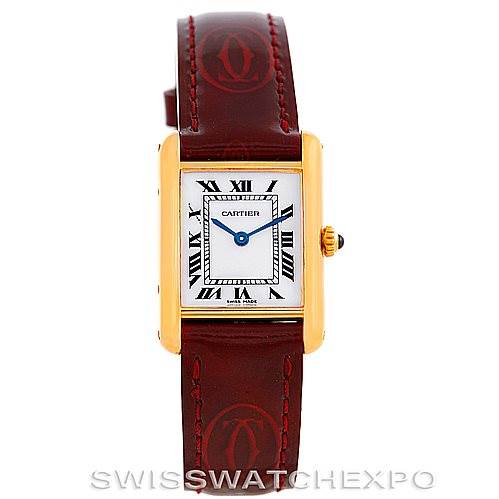 The image shows a front view of the Cartier Tank Classic Women's Yellow Gold White Dial Women's Yellow Gold White Dial watch with a gold case, white dial, Roman numerals, blue hands, and a brown leather strap.
