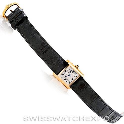 This image displays a Cartier Tank Classic Women's Yellow Gold Silver Dial Women's Yellow Gold Silver Dial watch laid flat, showing the face, case, strap, and buckle from a top-down angle.
