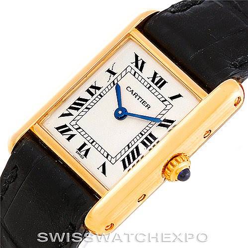 The image shows the dial, case, crown, and part of the strap of a Cartier Tank Classic Women's Yellow Gold Silver Dial Women's Yellow Gold Silver Dial watch at an angled top view.