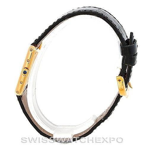 This is a side view of the Cartier Tank Classic Women's Yellow Gold Silver Dial Women's Yellow Gold Silver Dial model, showing its case, leather strap, and crown.