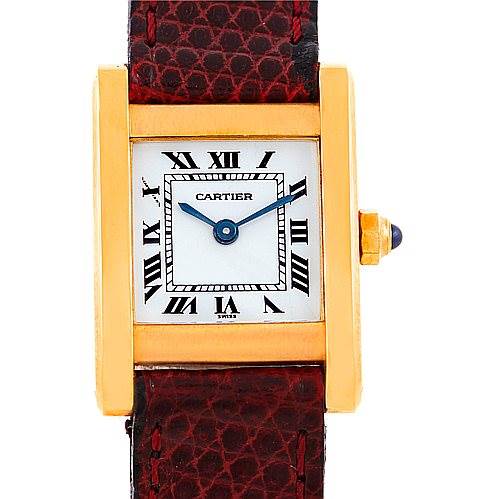 The Cartier Tank Classic Women's Yellow Gold White Dial Women's Yellow Gold White Dial watch is shown from a front angle, highlighting the dial, case, and part of the leather strap.