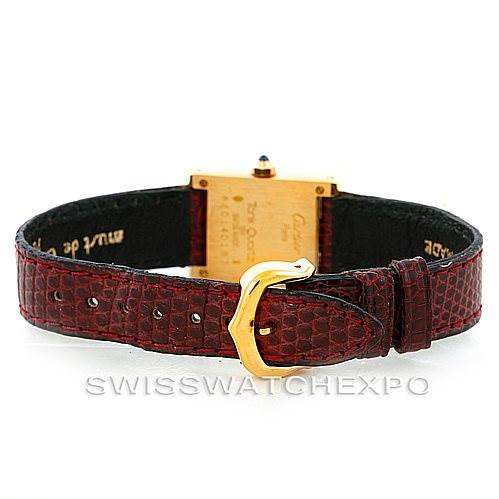 The image shows the back view of a Cartier Tank Classic Women's Yellow Gold White Dial Women's Yellow Gold White Dial watch with a gold case and a maroon leather strap.