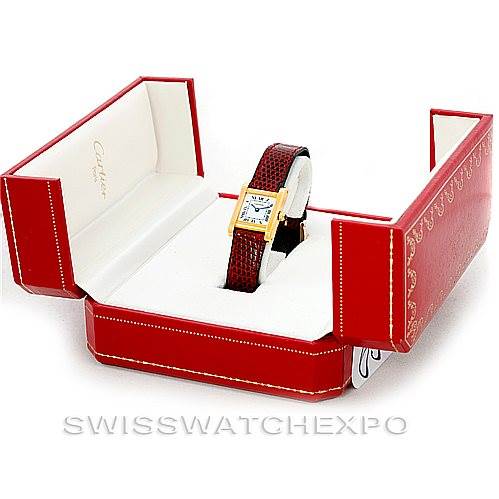 The Cartier Tank Classic Women's Yellow Gold White Dial Women's Yellow Gold White Dial watch is displayed at a front angle in its open red and white box.