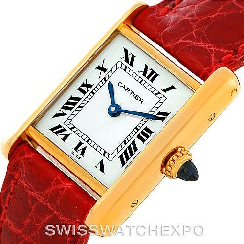 The image shows a Cartier Tank Classic Women's Yellow Gold White Dial Women's Yellow Gold White Dial watch from a close-up angle, highlighting the dial, hands, and red leather strap.