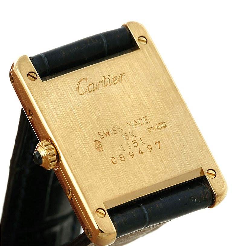 This image shows the back case and crown of the Cartier Tank Classic Women's Yellow Gold Silver Dial Women's Yellow Gold Silver Dial watch at an angled view.