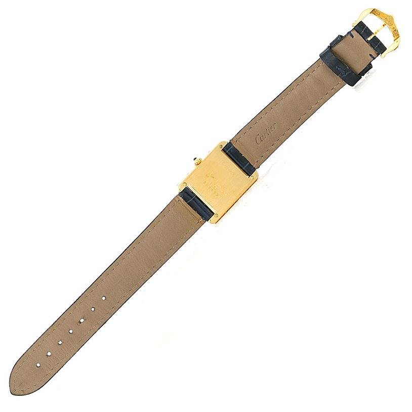 The image shows the back view of a Cartier Tank Classic Women's Yellow Gold Silver Dial Women's Yellow Gold Silver Dial watch, including the leather strap and buckle.