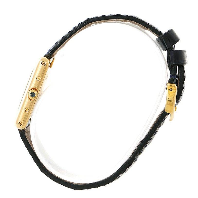 This side view of the Cartier Tank Classic Women's Yellow Gold Silver Dial Women's Yellow Gold Silver Dial watch shows its gold case and black leather strap.