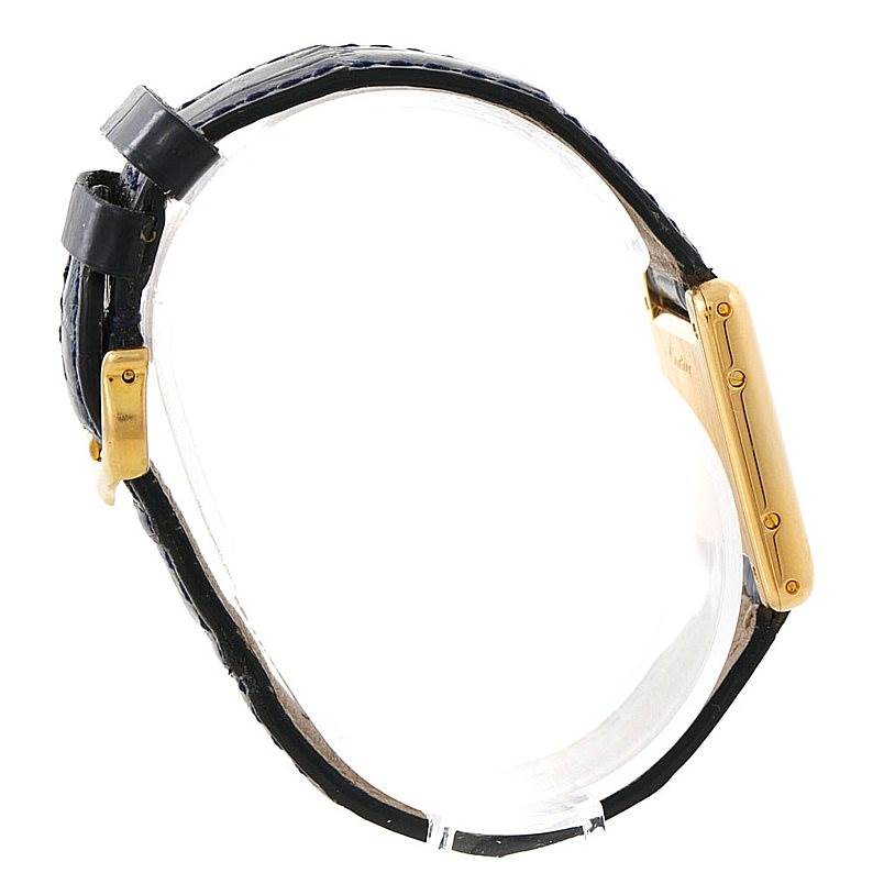 This image shows a side view of the Cartier Tank Classic Women's Yellow Gold Silver Dial Women's Yellow Gold Silver Dial watch, highlighting its strap and gold-colored side casing.