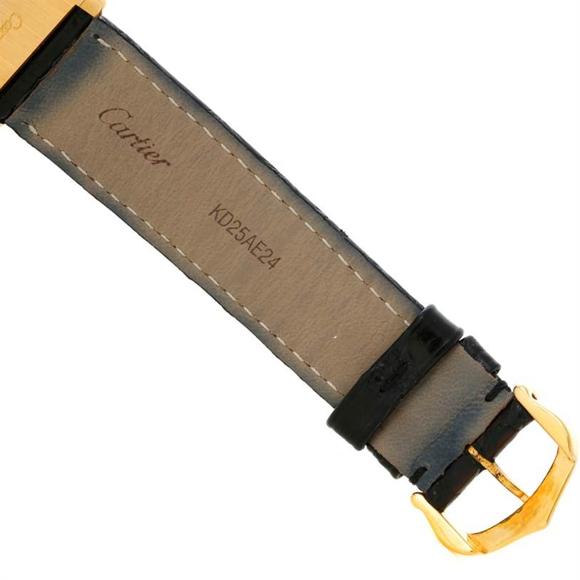 This image shows the back of the leather strap and gold buckle of a Cartier Tank Classic Yellow Gold White Dial Yellow Gold White Dial watch.