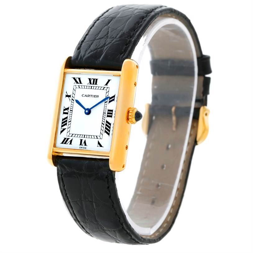 The image shows a side angle of a Cartier Tank Classic Yellow Gold White Dial Yellow Gold White Dial watch, highlighting its rectangular face, Roman numeral indices, and black leather strap.