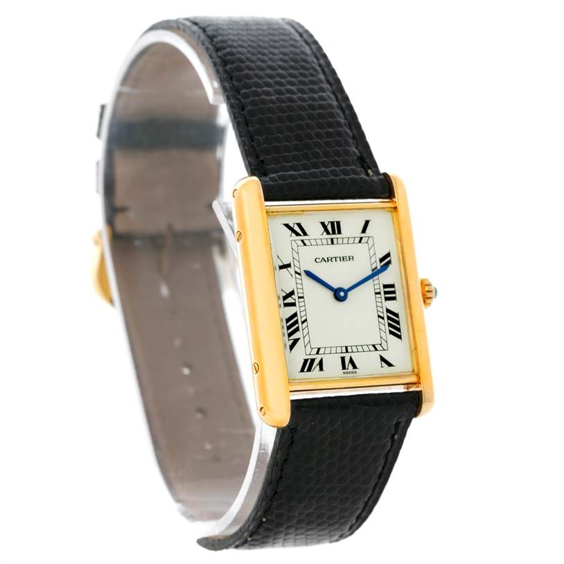 The image shows a Cartier Tank Classic Yellow Gold Beige Dial Yellow Gold Beige Dial watch with a front angle view, displaying the face, leather strap, and gold case.