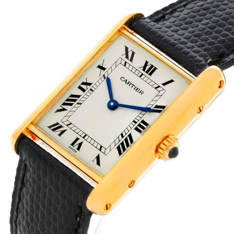 This image showcases the Tank Classic by Cartier from an angled top view, highlighting the watch face, hands, and part of the strap.