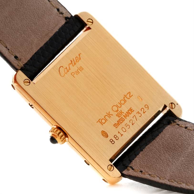 The image shows the back case and leather strap attachment of a Cartier Tank Classic Yellow Gold Beige Dial Yellow Gold Beige Dial Quartz watch.