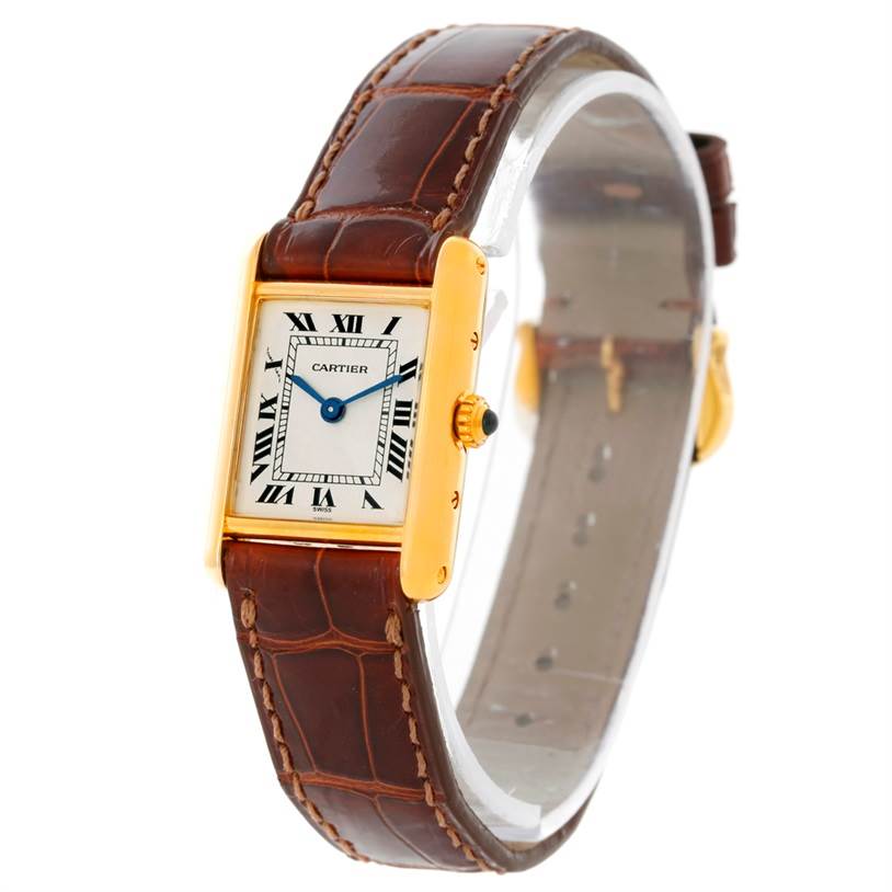 This image shows a Cartier Tank Classic Women's Yellow Gold Silver Dial Women's Yellow Gold Silver Dial watch at a three-quarter angle, highlighting its rectangular face, gold trim, and brown leather strap.