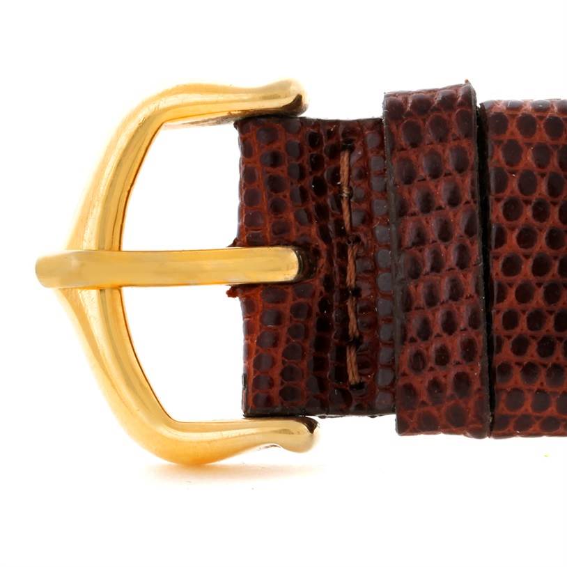 This image shows a close-up view of a brown leather strap buckle for the Cartier Tank Classic Yellow Gold Beige Dial Yellow Gold Beige Dial watch.