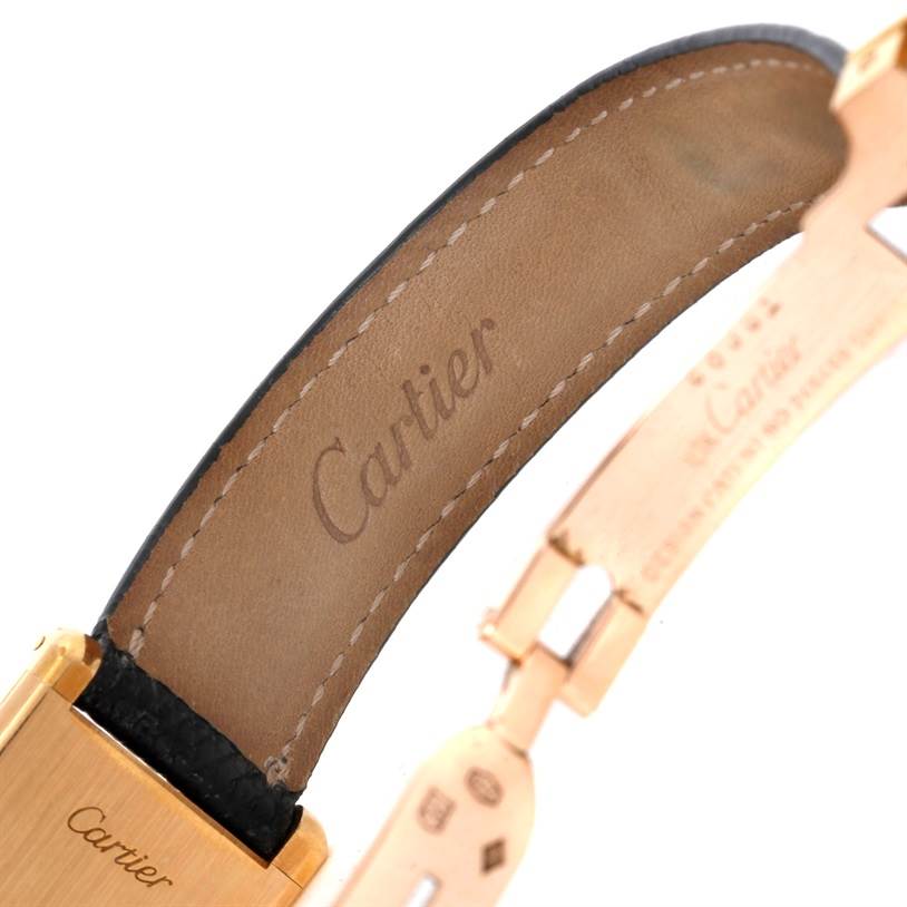 This image shows the inner side of the leather strap and the clasp of a Cartier Tank Classic Women's Yellow Gold White Dial Women's Yellow Gold White Dial watch.