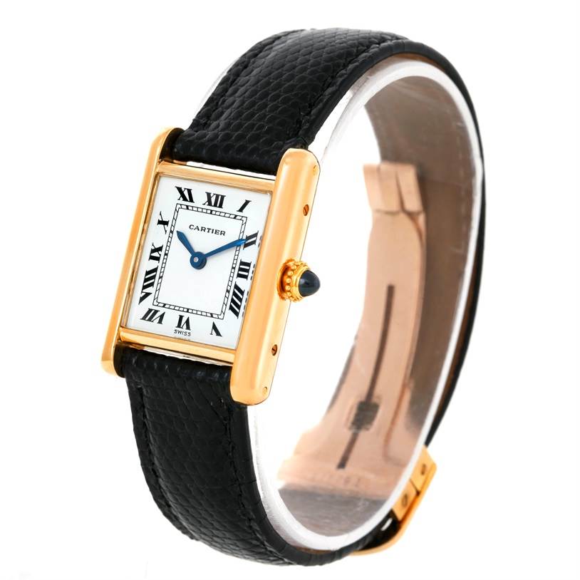 The image shows a Cartier Tank Classic Women's Yellow Gold White Dial Women's Yellow Gold White Dial watch at an angled side view, highlighting its gold case, black leather strap, and crown.