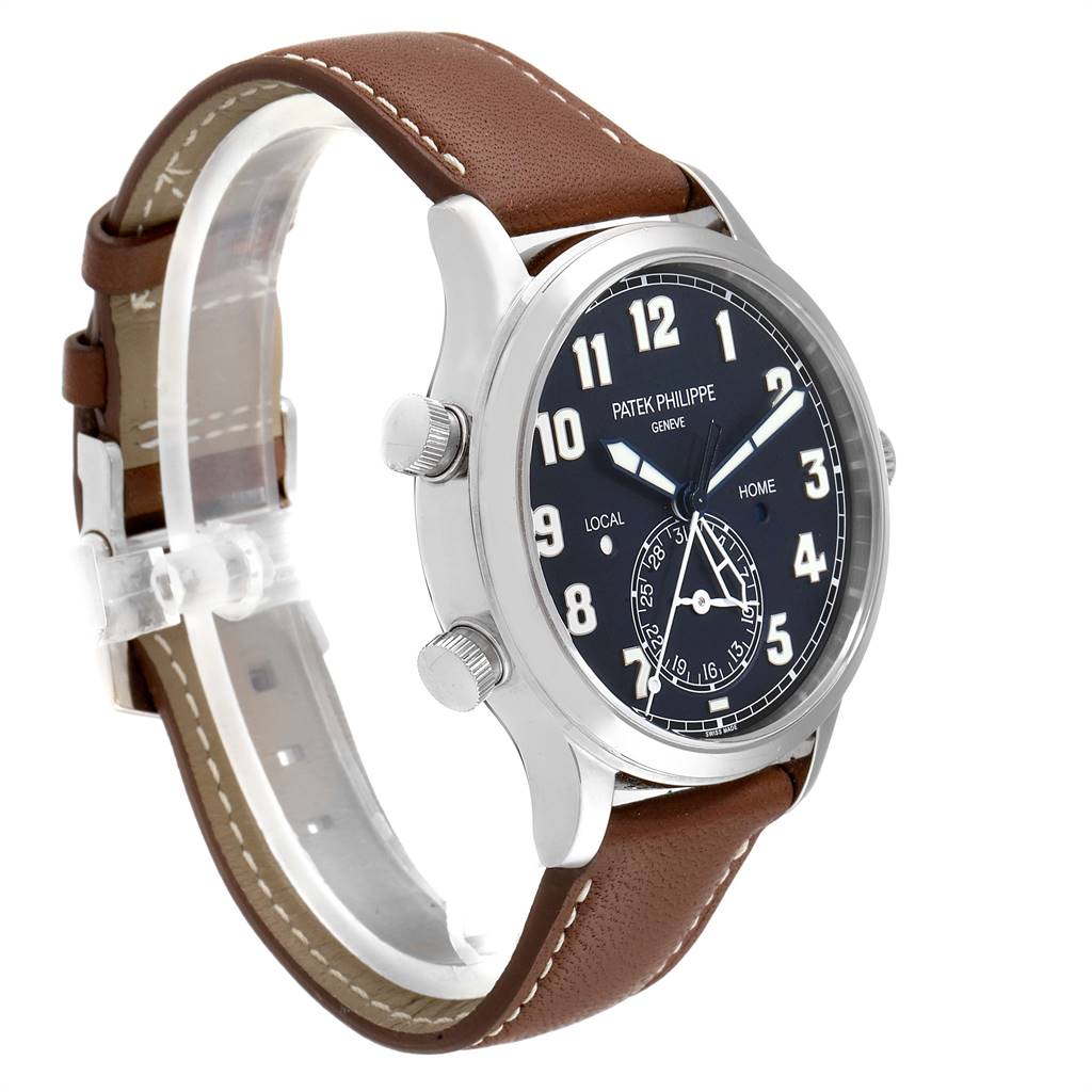 The image shows a Patek Philippe Calatrava 5524G Men's White Gold Blue Dial 5524G Men's White Gold Blue Dial watch at an oblique angle, highlighting its dial, casing, and brown leather strap.