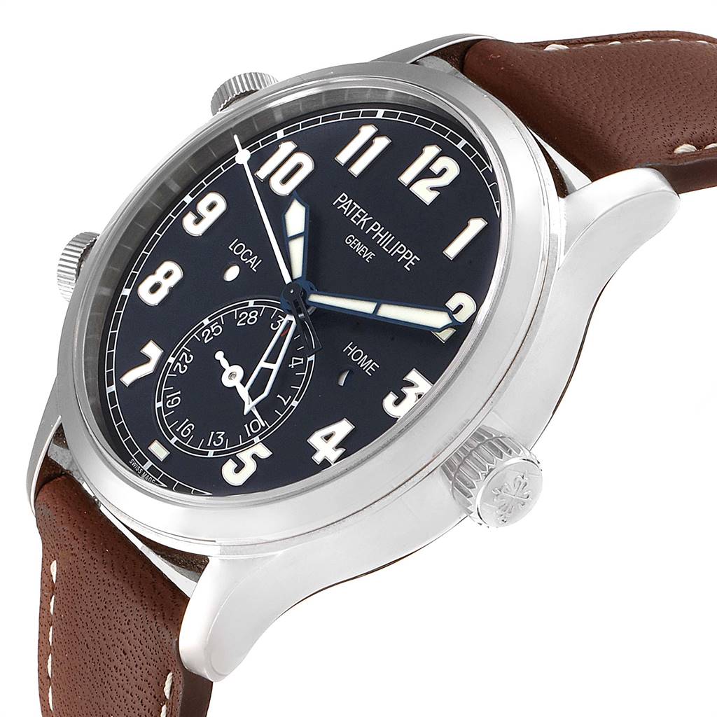 The image shows a slight angled side view of the Patek Philippe Calatrava 5524G Men's White Gold Blue Dial 5524G Men's White Gold Blue Dial watch, focusing on its dial, crown, and leather strap.