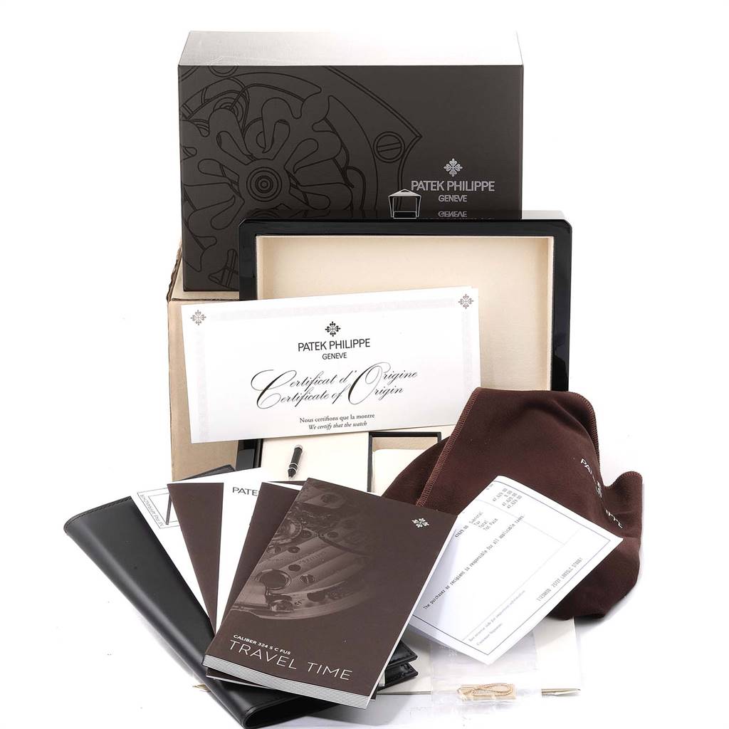 The image shows the packaging and documentation for a Patek Philippe Calatrava 5524G Men's White Gold Blue Dial 5524G Men's White Gold Blue Dial, including the certificate of origin, manuals, and accessories.