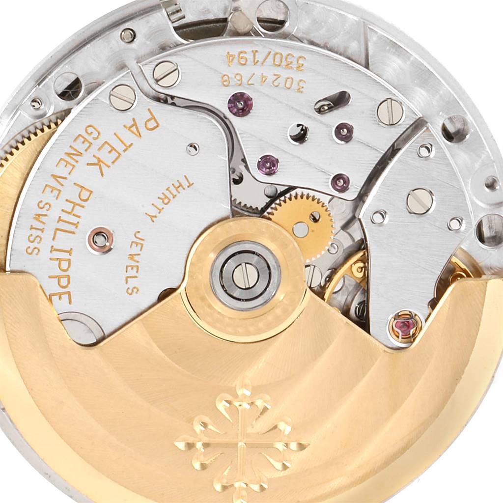 The image shows a close-up of the movement and internal mechanism of a Patek Philippe Nautilus 3800 Men's Stainless Steel White Dial 3800 Men's Stainless Steel White Dial watch.