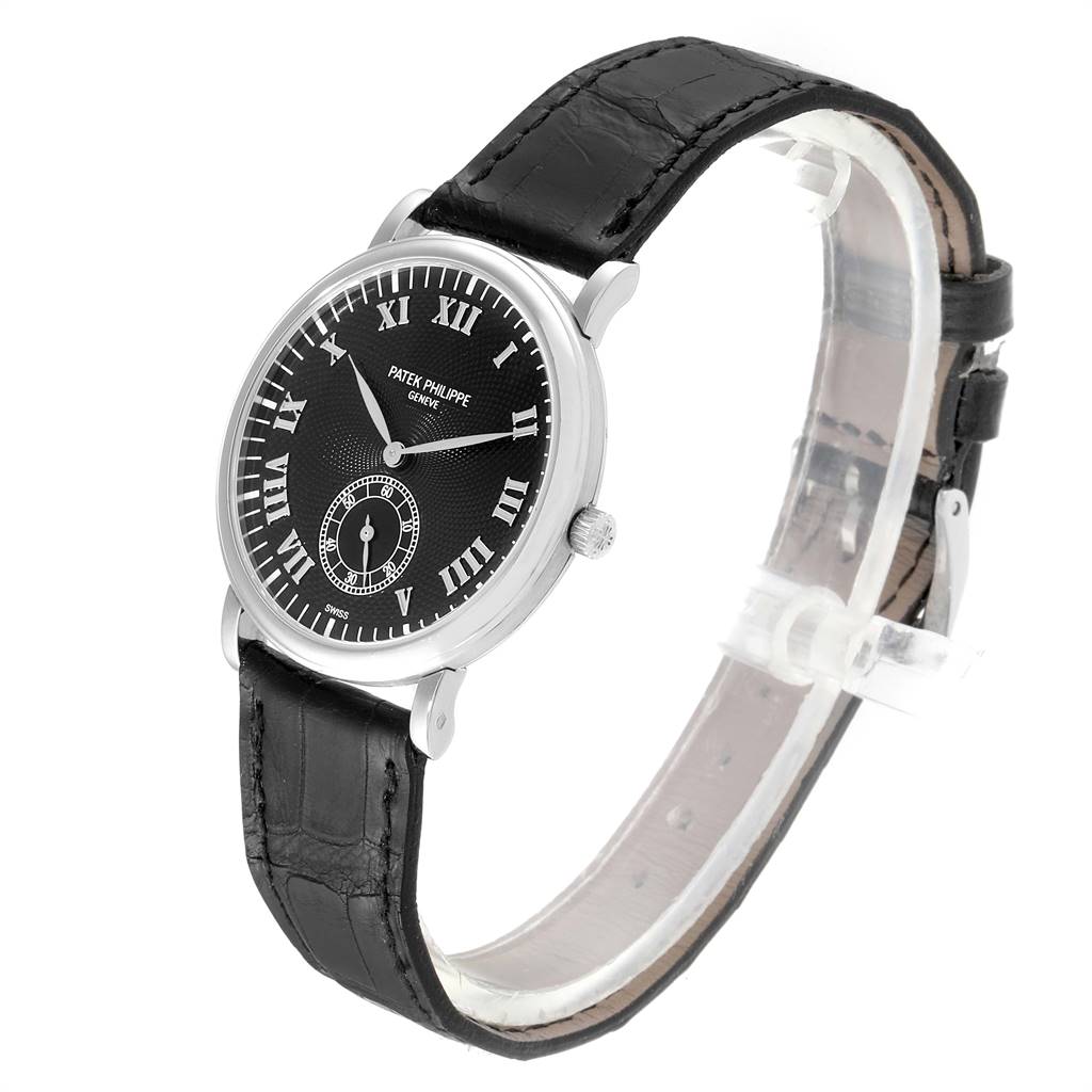 The image shows a Patek Philippe Calatrava 5022 Men's White Gold Black Dial 5022 Men's White Gold Black Dial watch angled to display its face, strap, and side crown.