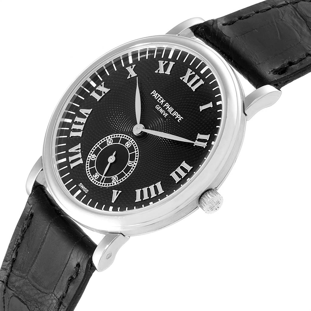 The image shows a Patek Philippe Calatrava 5022 Men's White Gold Black Dial 5022 Men's White Gold Black Dial watch at an angled side view, highlighting its black dial, Roman numerals, and leather strap.