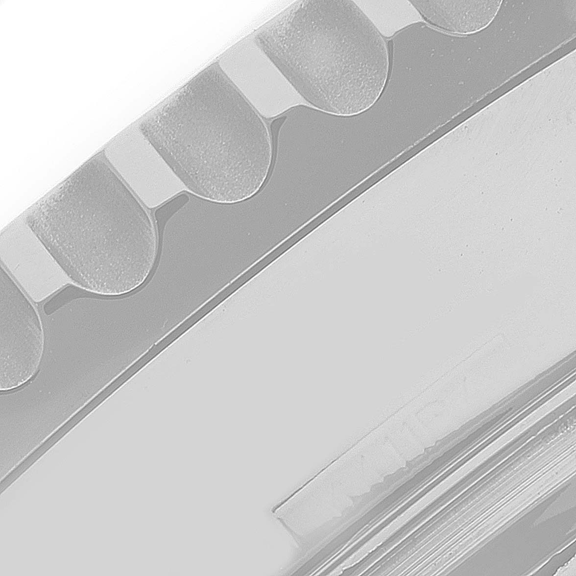 The image shows a close-up of the bezel and part of the casing of a Breitling Navitimer AB0120 Men's Stainless Steel Black Dial AB0120 Men's Stainless Steel Black Dial watch.