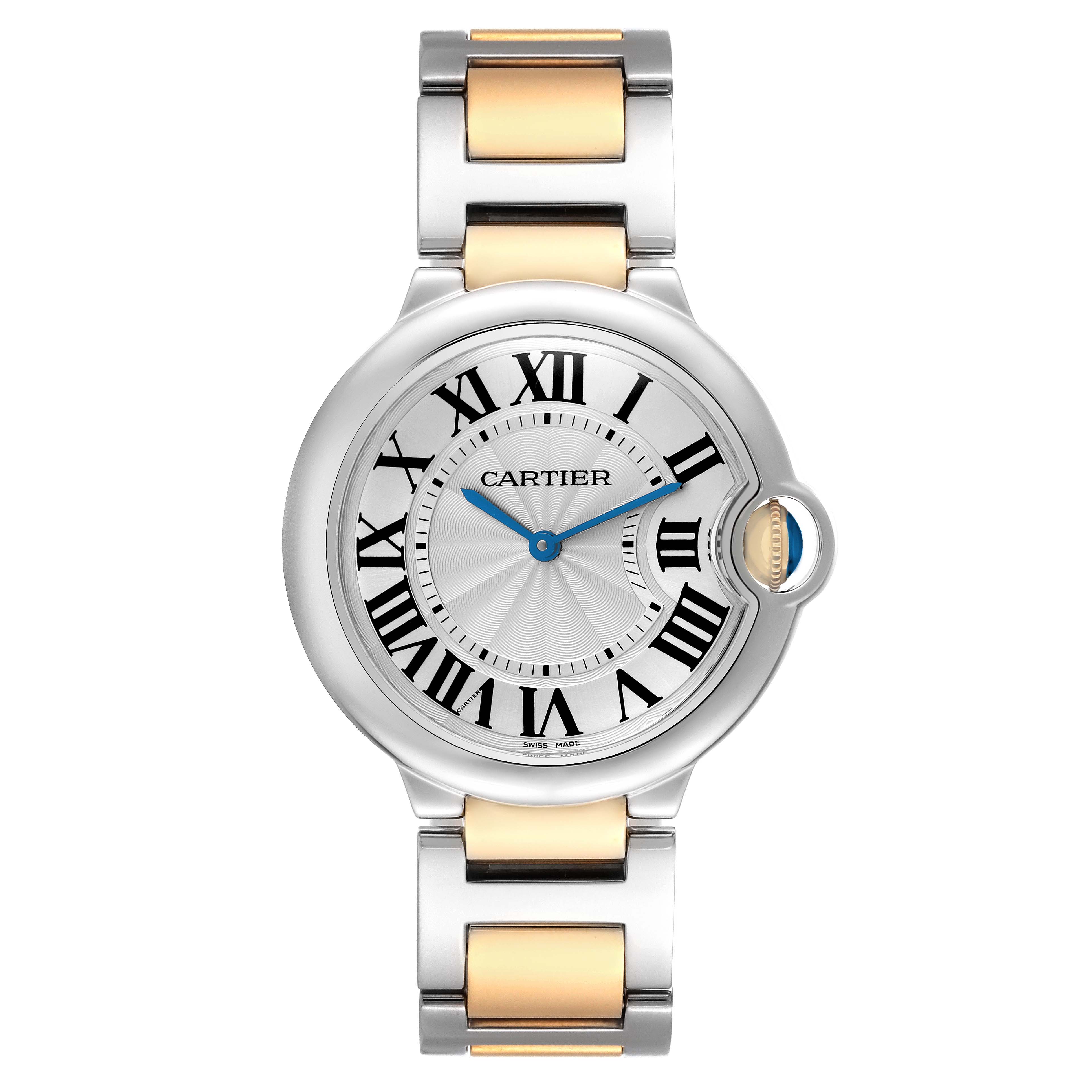 The Cartier Ballon Bleu model W69008Z3 men's watch is shown from a top-down angle, displaying the face, Roman numeral dial, blue hands, and metal bracelet.