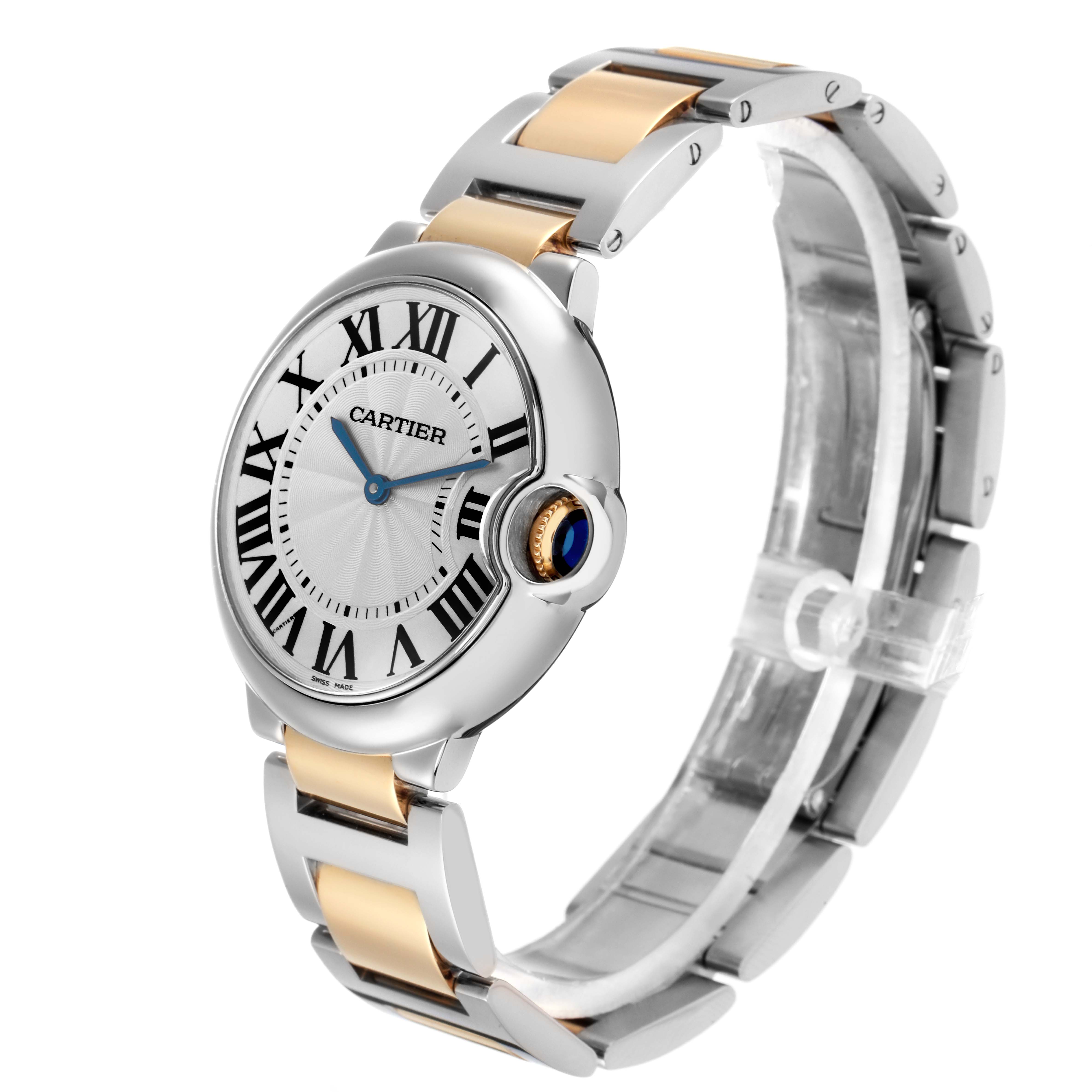 The image shows a Cartier Ballon Bleu model W69008Z3 watch from a side angle, highlighting the case, crown with a blue sapphire cabochon, and the two-tone bracelet.