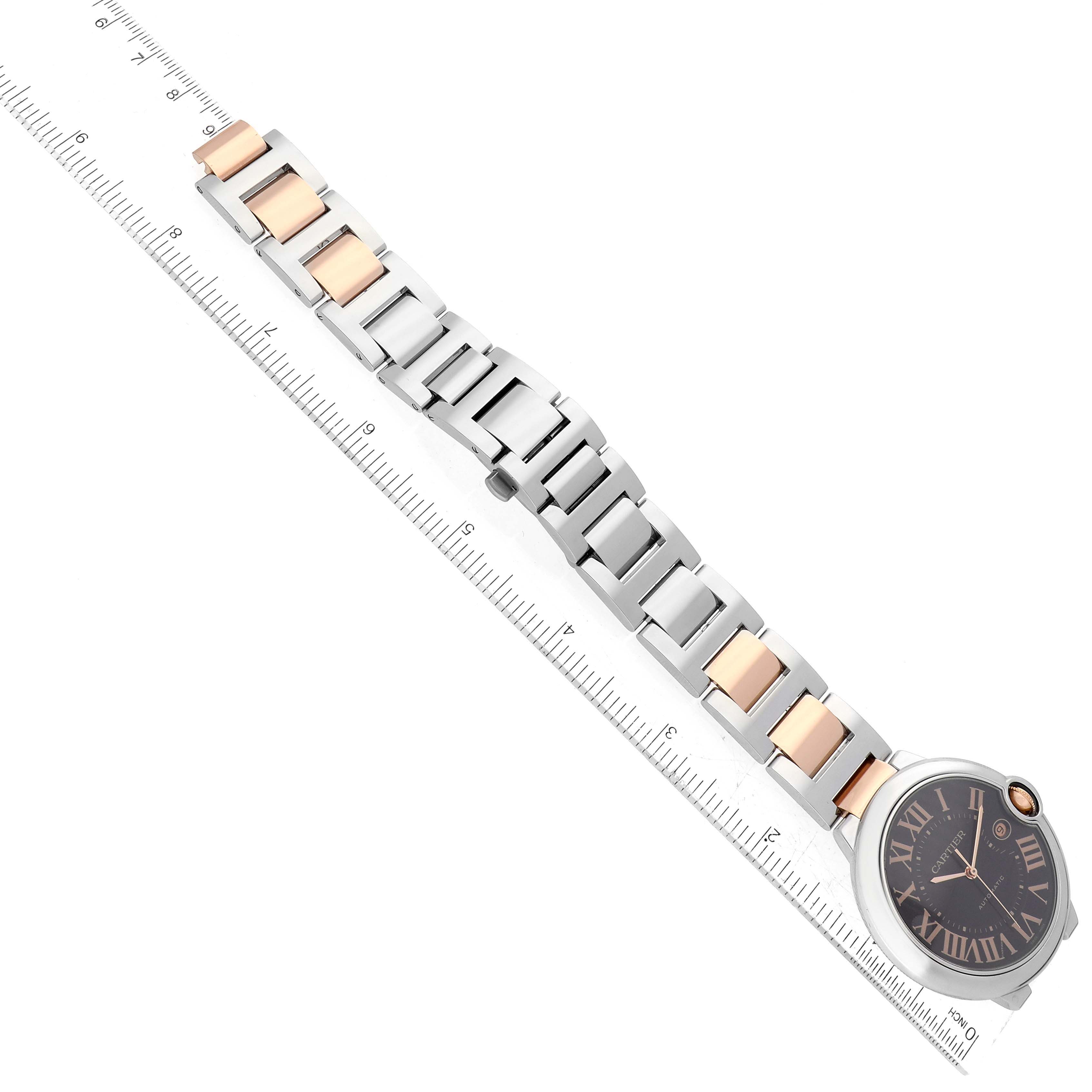 The image shows a Ballon Bleu model by Cartier, highlighting the watch face, band, and a ruler for measurement.