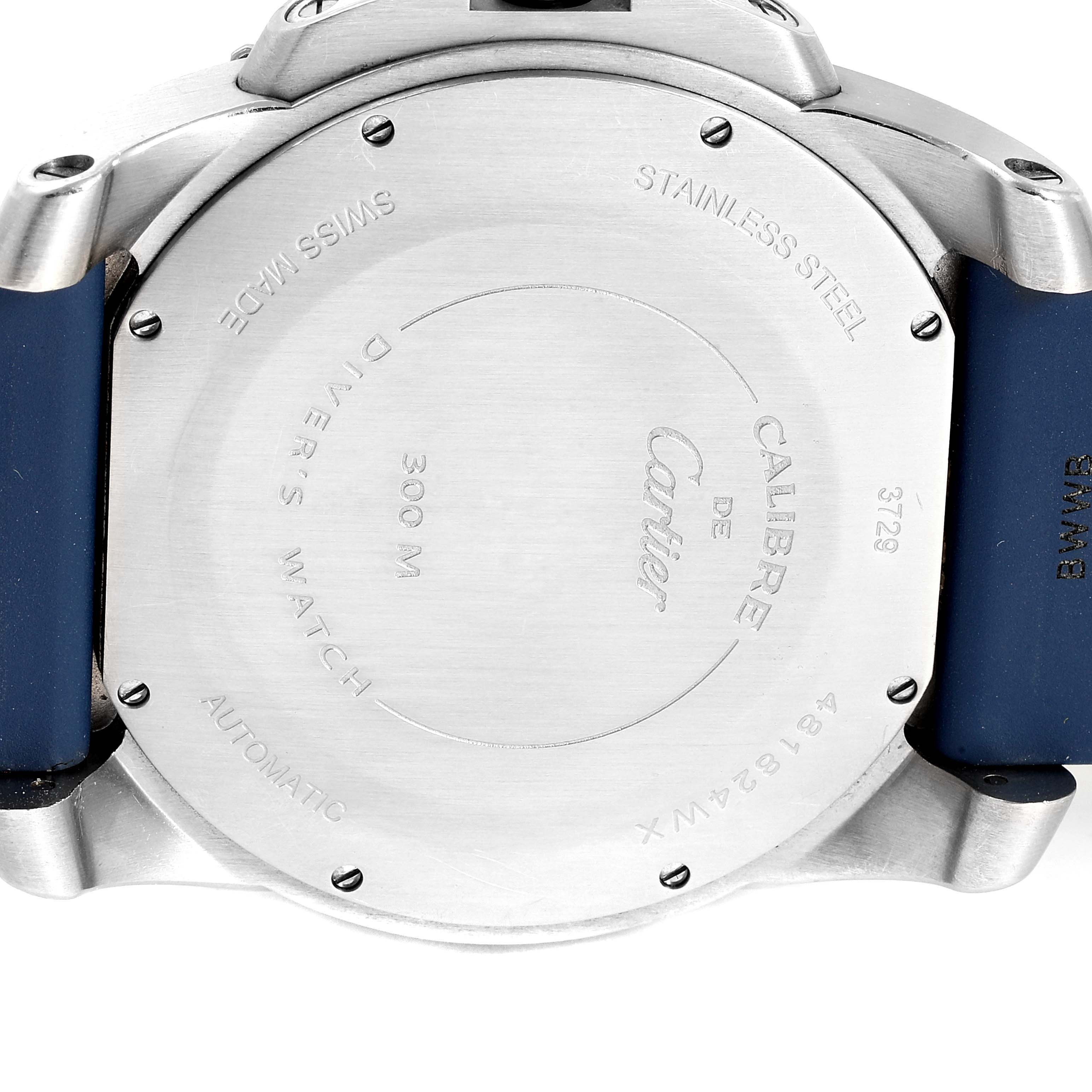 This image shows the back case of a Calibre de Cartier model by Cartier, featuring markings and a blue strap.