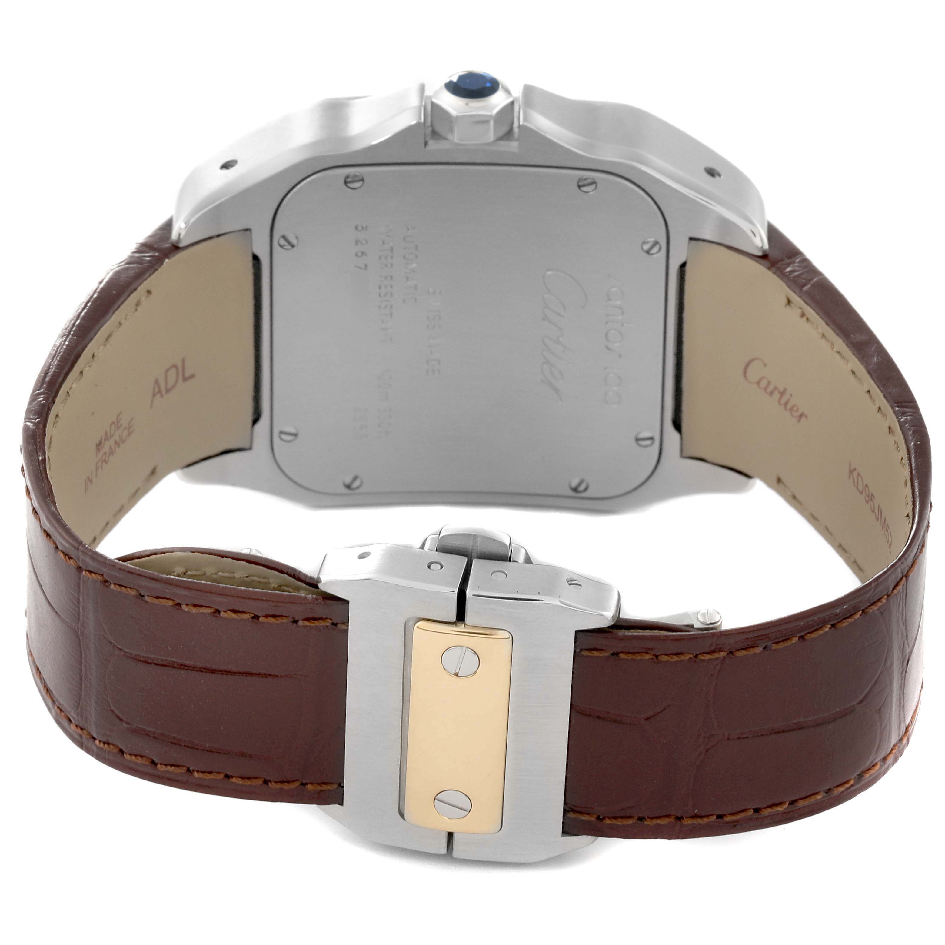 The image shows the back view of a Cartier Santos W20072X7 Men
s Steel and Gold (two tone) Silver Dial W20072X7 Men
s Steel and Gold (two tone) Silver Dial watch, including its case back, brown leather strap, and clasp.